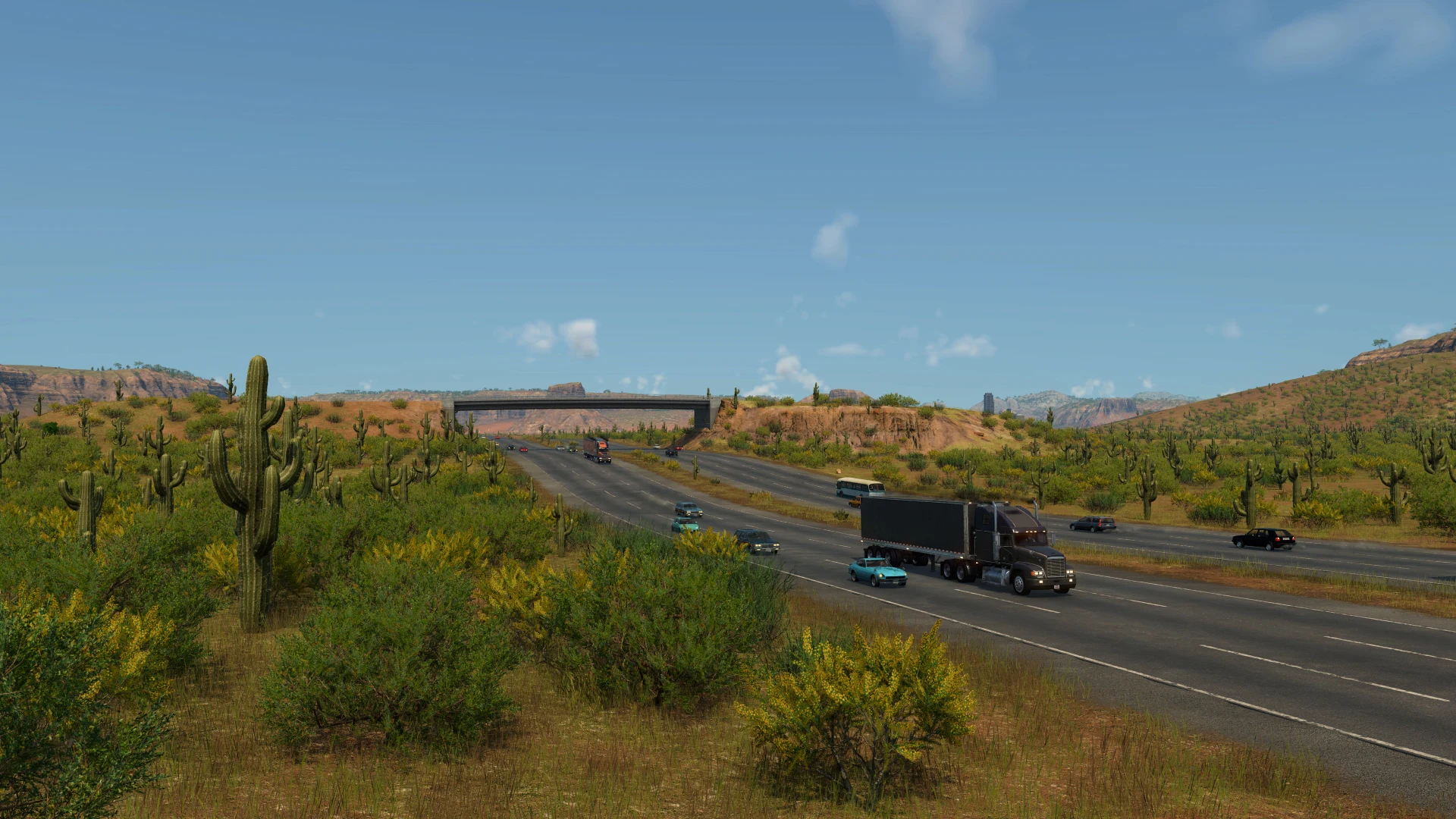 Desert highway with semi-trucks and elevated bridge in arid rocky landscape — official TF3 press kit